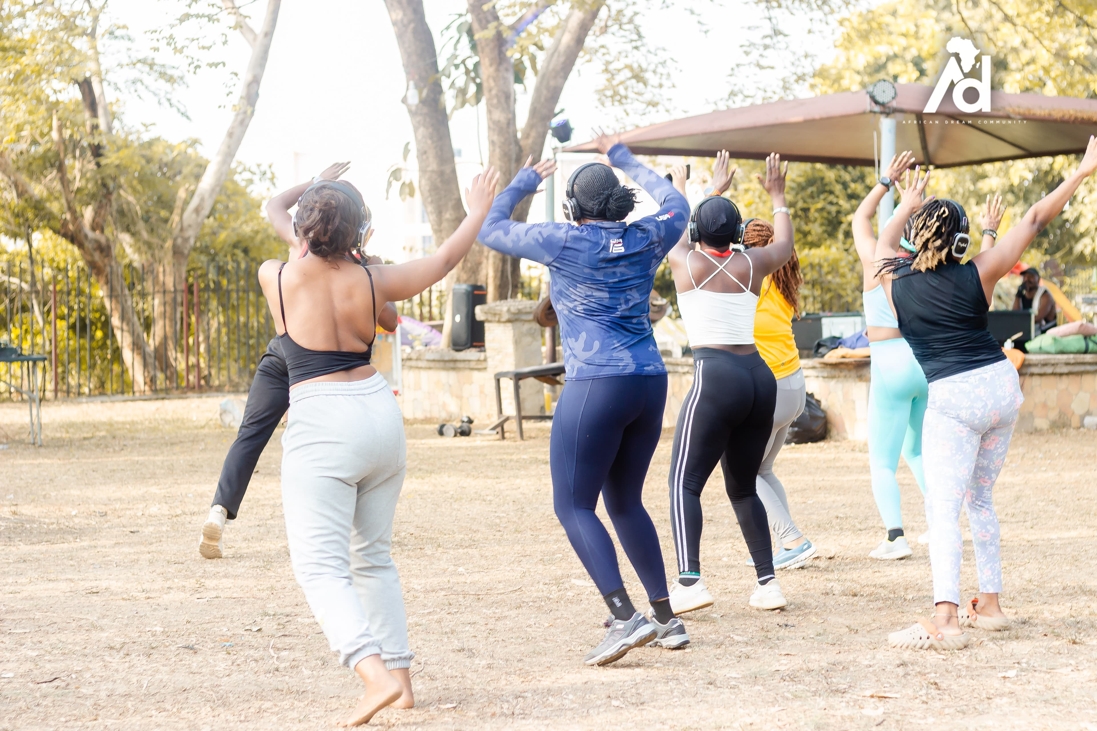 Professional team collaborating outdoors in a lush natural setting